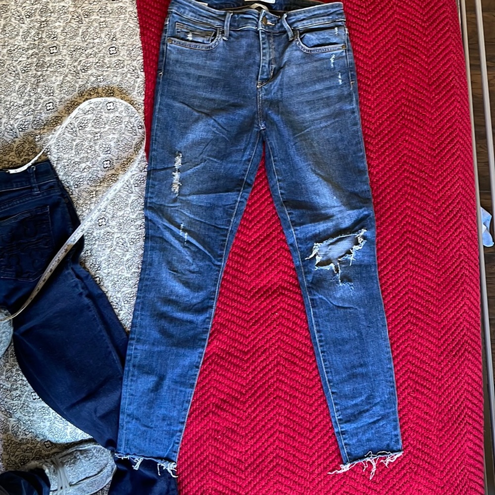Women Sam Edelman blue distressed jeans.
